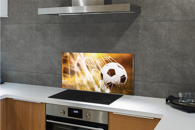 Painel de vidro Bola amarela em fundo de grama