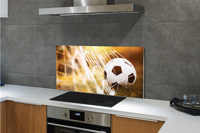 Painel de vidro Bola amarela em fundo de grama