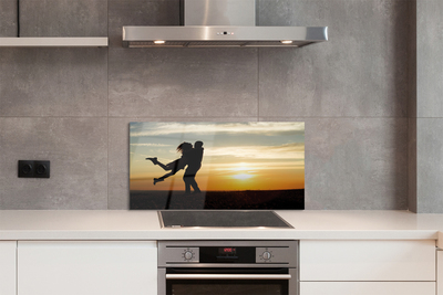 Painel de vidro Pessoas pôr do sol nuvens