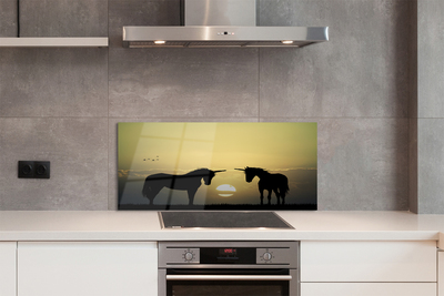 Painel de vidro Unicórnios do pôr do sol no campo