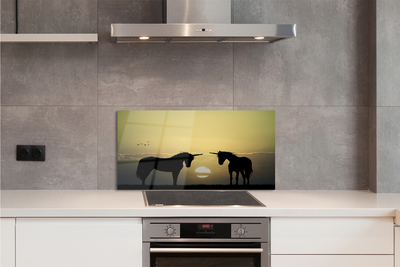 Painel de vidro Unicórnios do pôr do sol no campo