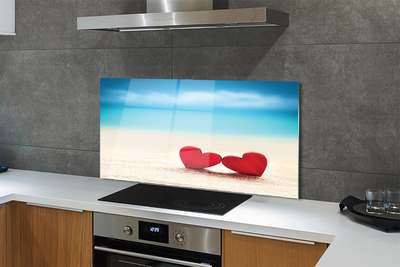 Painel de vidro Corações de areia vermelha do mar