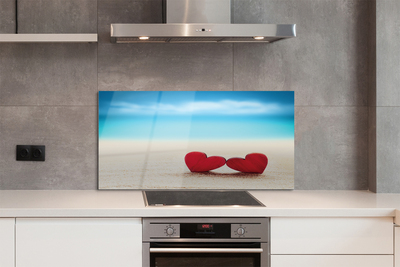 Painel de vidro Corações de areia vermelha do mar