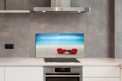 Painel de vidro Corações de areia vermelha do mar