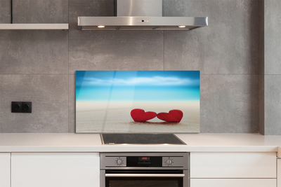 Painel de vidro Corações de areia vermelha do mar