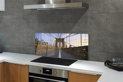 Painel de vidro Pôr do sol na ponte dos arranha-céus