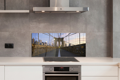 Painel de vidro Pôr do sol na ponte dos arranha-céus