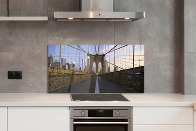 Painel de vidro Pôr do sol na ponte dos arranha-céus