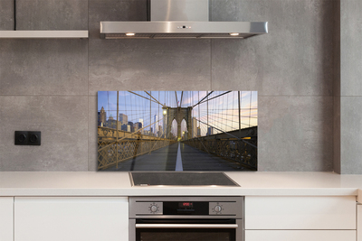 Painel de vidro Pôr do sol na ponte dos arranha-céus