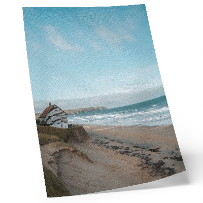 Impressão em tela Praia, ondas, casa em um penhasco, cores pastel