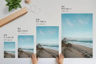 Impressão em tela praia com ondas e casa em um penhasco em cores pastel