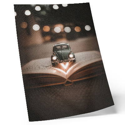 Arte de parede Carrinho em miniatura sobre um livro com luzes mágicas
