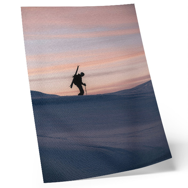 Arte de parede Esquiador contra um céu rosa em uma paisagem de inverno
