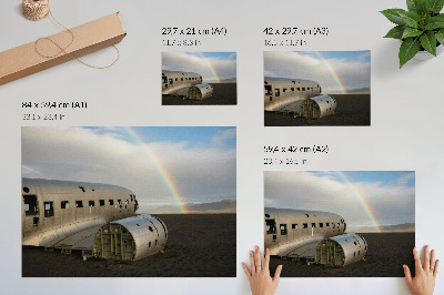Poster em tela Os destroços de um avião de metal com um arco-íris ao fundo.