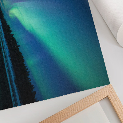 Poster mural Aurora boreal sobre um lago congelado à noite.