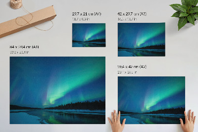 Poster mural Aurora boreal sobre um lago congelado à noite.