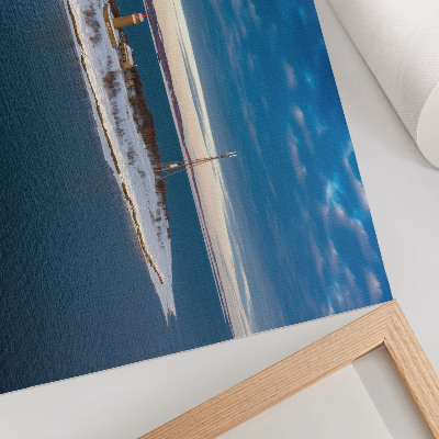 Poster mural Ilha de inverno com um farol e mar azul.