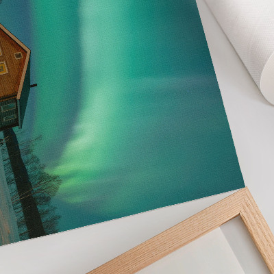 Poster em tela Aurora boreal sobre a casa de campo de inverno