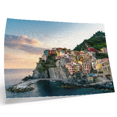 Poster Casas coloridas em um penhasco acima do mar.