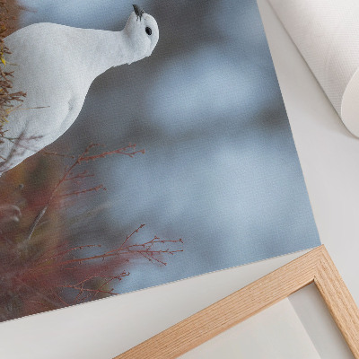Poster Um pássaro branco em um cenário de inverno.