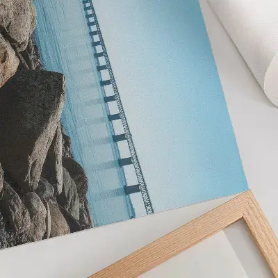 Ponte sobre pedras azuis na margem poster em tela
