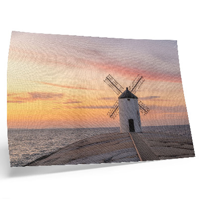 Poster mural Moinho de vento ao pôr do sol, mar, céu em tons pastel