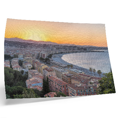 Poster em tela Vista da cidade ao pôr do sol sobre o mar.