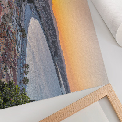Poster em tela Vista da cidade ao pôr do sol sobre o mar.