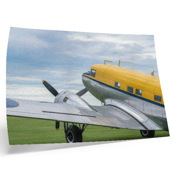 Poster Avião clássico e elegante nas cores amarelo, cinza e azul.