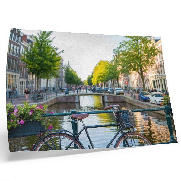 Poster em tela Canal, ponte, árvores, edifícios, bicicleta, flores