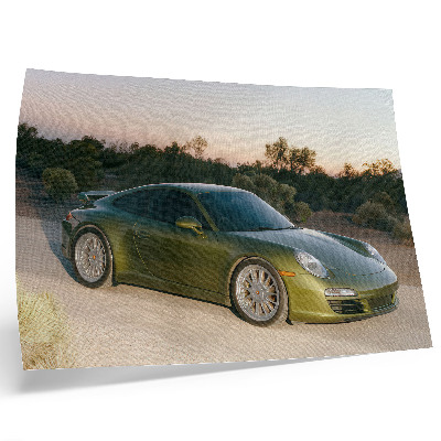 Poster em tela Carro esportivo verde pôr do sol no deserto