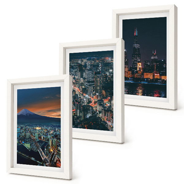 Conjunto de 3 quadros decorativos Vista da cidade à noite, com os arranha-céus ao fundo.