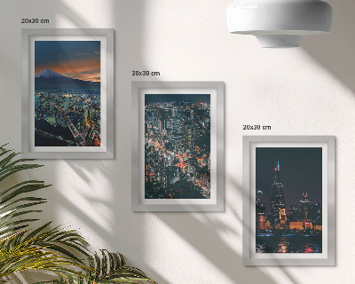 Conjunto de 3 quadros decorativos Vista da cidade à noite, com os arranha-céus ao fundo.
