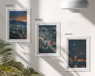 Conjunto de 3 quadros decorativos Vista da cidade à noite, com os arranha-céus ao fundo.
