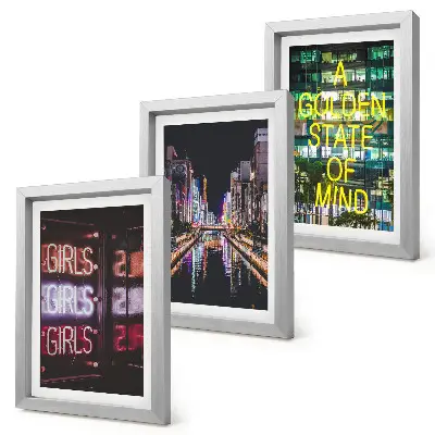 Conjunto de 3 quadros decorativos com estampa de letreiros de néon da cidade à noite com vista para o rio