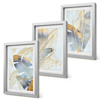 Conjunto de 3 quadros decorativos Folhas em tons de azul e bege sobre um fundo claro.