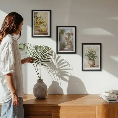 Conjunto de 3 quadros decorativos com estampa de limões em vaso e plantas em arquitetura branca