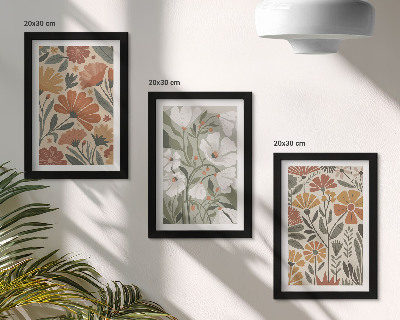 Tríptico com moldura Estampas florais em tons de laranja e verde.