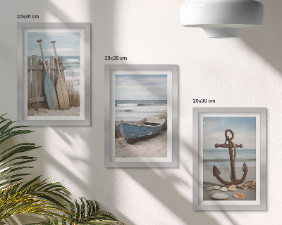 Conjunto de molduras com imagens Uma praia com um barco a remo e uma âncora na areia.