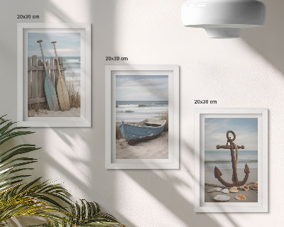 Conjunto de molduras com imagens Uma praia com um barco a remo e uma âncora na areia.