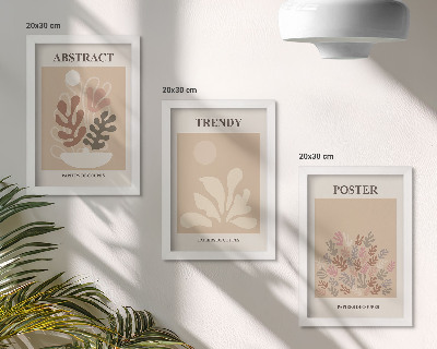 Conjunto de 3 quadros decorativos Pôsteres com motivos de plantas em tons de bege e marrom.