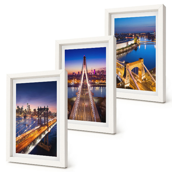 Tríptico com moldura Vistas noturnas de cidades com pontes e rios.