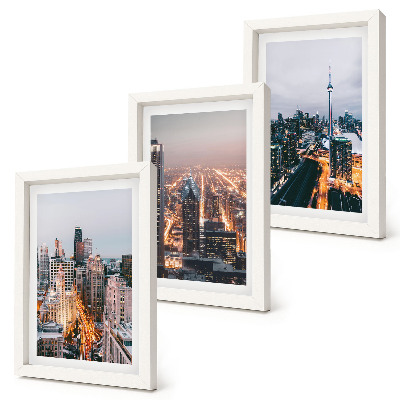 Conjunto de 3 quadros decorativos Vista noturna da cidade com arranha-céus e luzes.