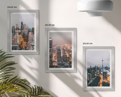 Conjunto de 3 quadros decorativos Vista noturna da cidade com arranha-céus e luzes.