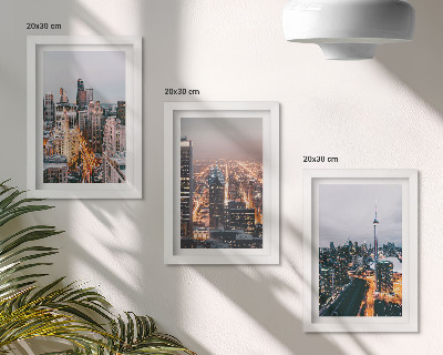 Conjunto de 3 quadros decorativos Vista noturna da cidade com arranha-céus e luzes.