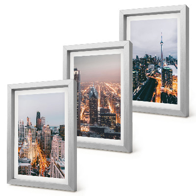 Conjunto de 3 quadros decorativos Vista noturna da cidade com arranha-céus e luzes.
