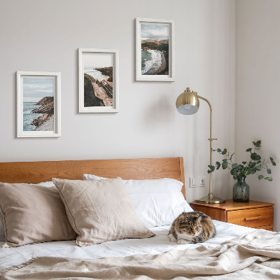 Conjunto de 3 quadros decorativos Vistas para o mar com falésias e paisagens de praia.