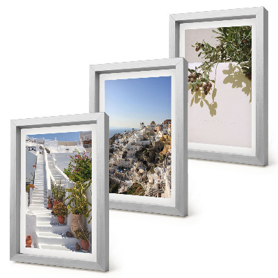 Conjunto de molduras com imagens Escadaria branca em Santorini com vista para a cidade.