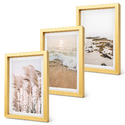 Tríptico com moldura Ondas de grama na praia e pedras à beira-mar em estilo boho.