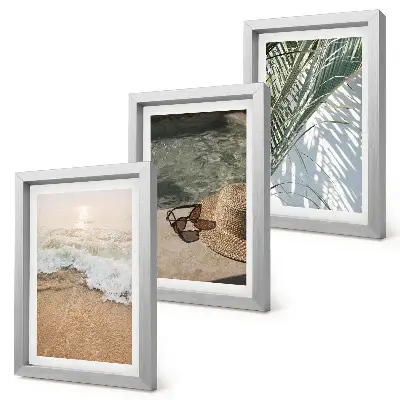Conjunto de quadros com imagens chapéu de praia e óculos de sol com folhas